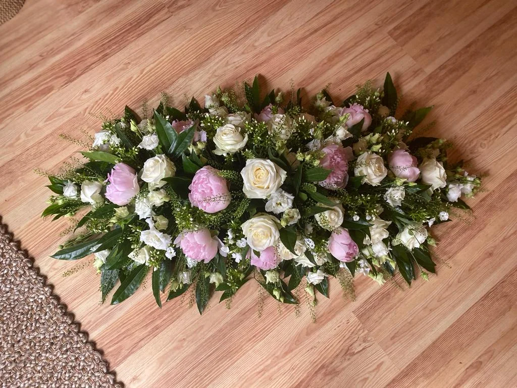 Funeral coffin spray by The Willows Florist
