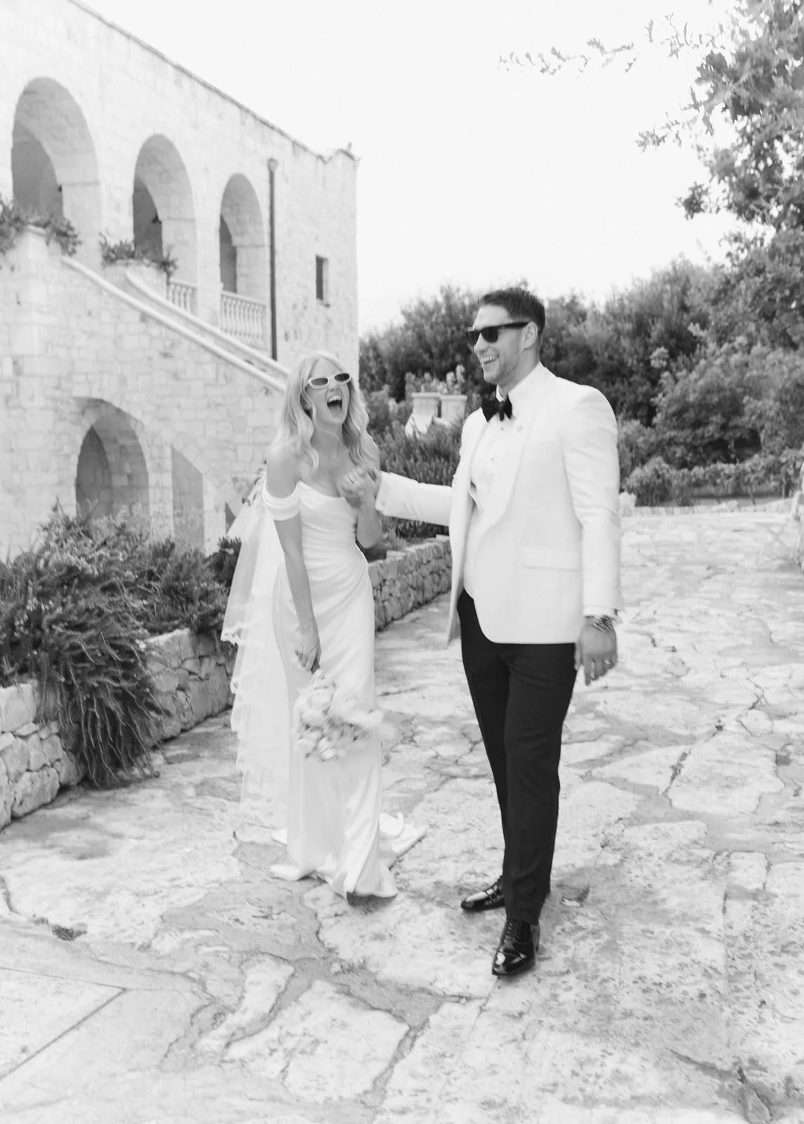 Bride and groom with wedding flowers
