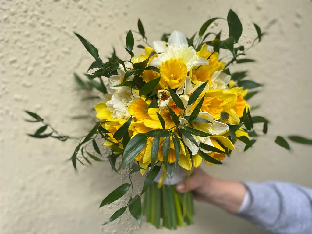 Yellow and white bridal bouquet with foliage
